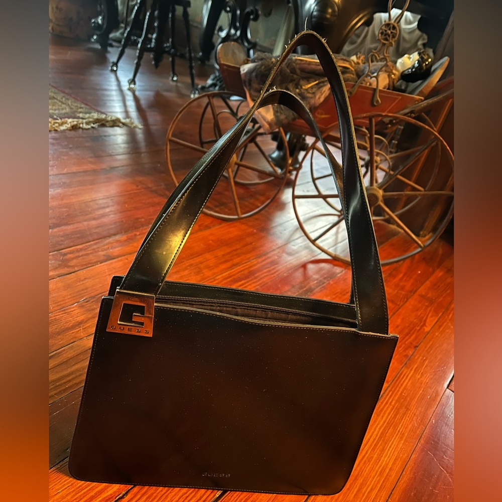 Vintage Guess women’s black handbag with silver detailing